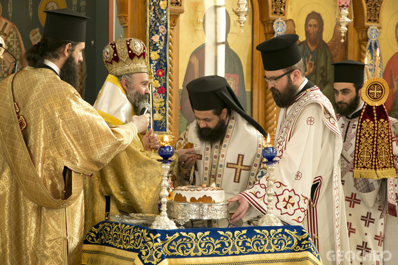 Bishop Milonas collecting Vasilopita from Archbishop Makarios