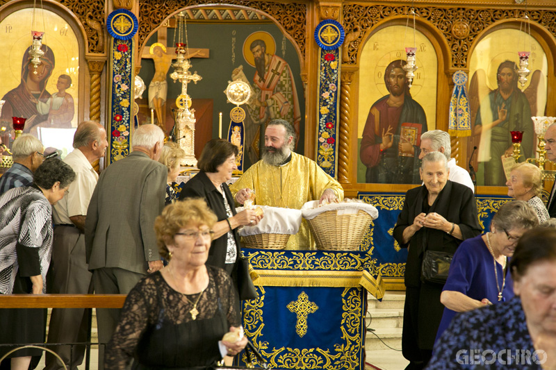 The Laity collecting Prosforo at St Nicholas Church, distributed by Archbishop Makarios